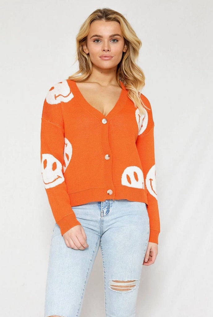 Orange smiley face sweater