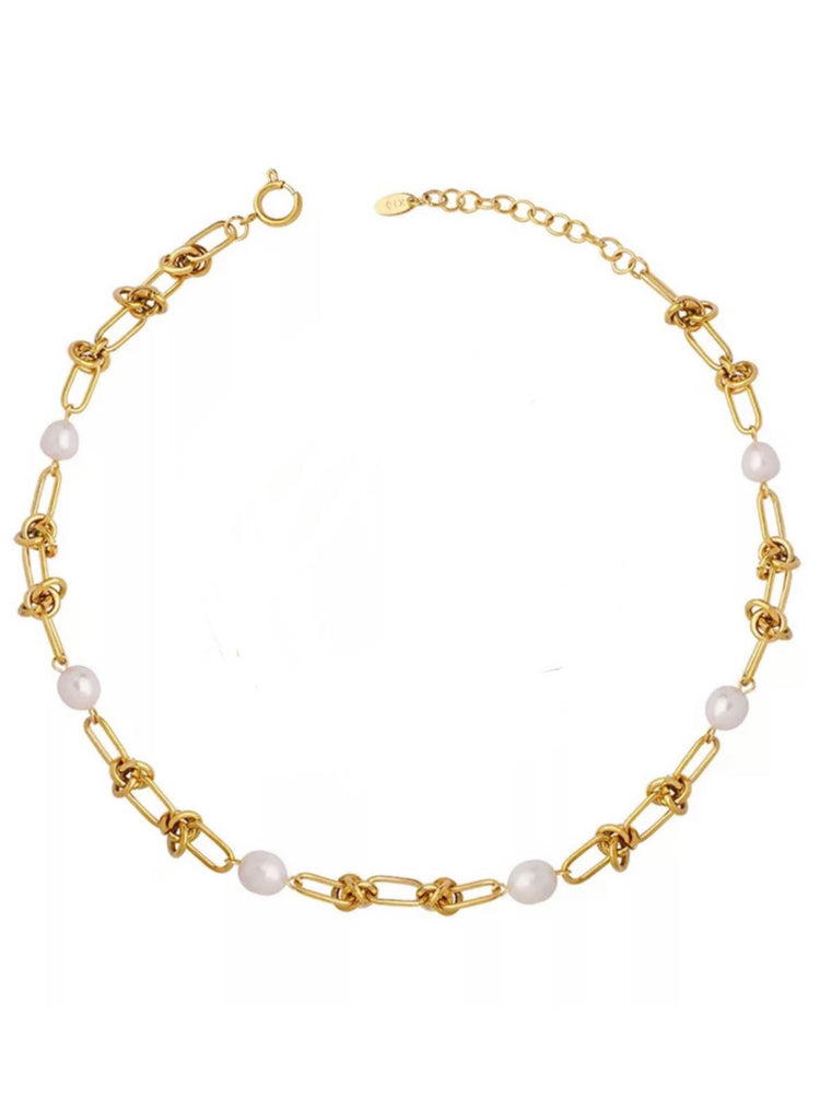 linked gold chain and pearl necklace